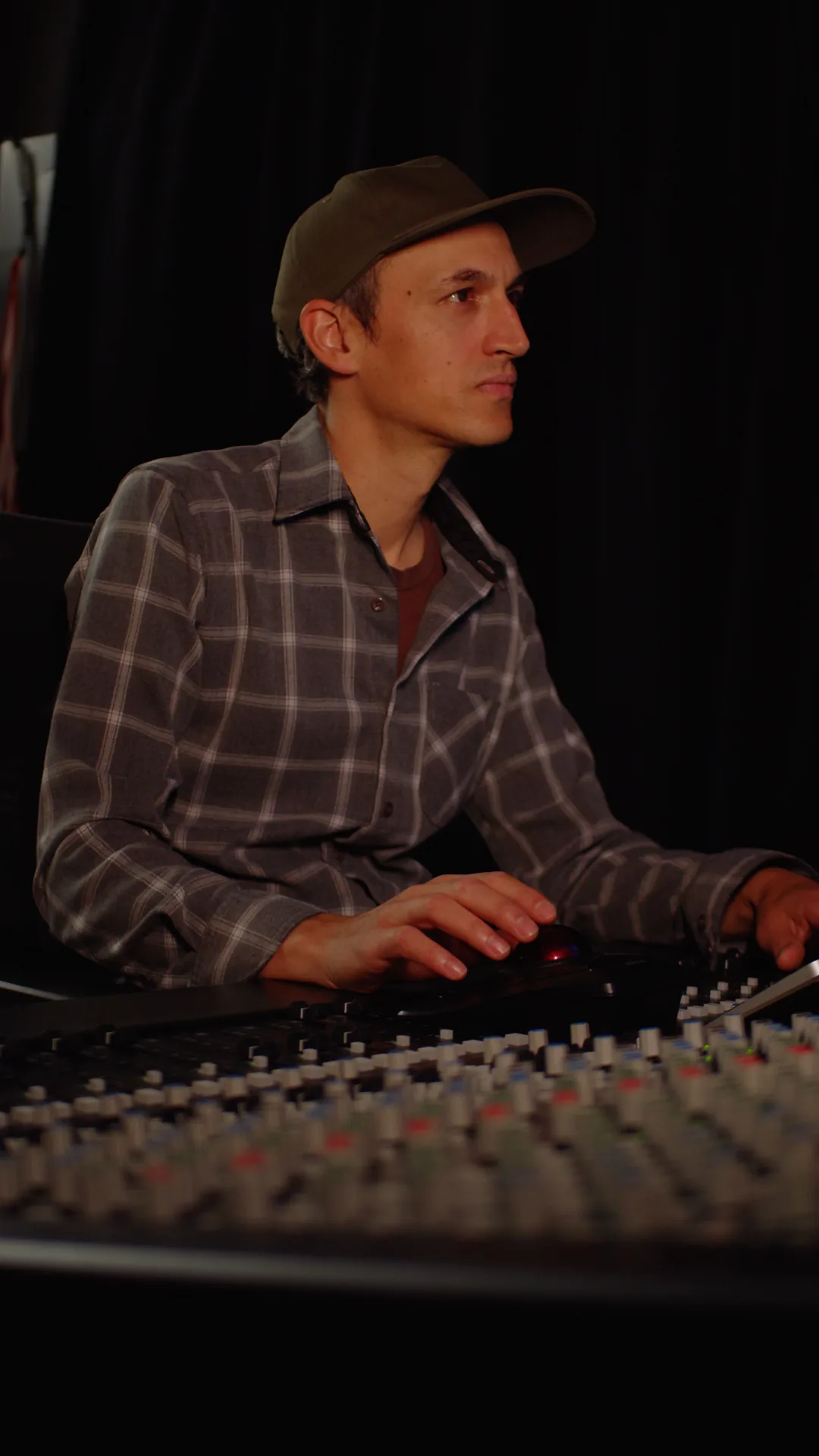 Ben Leggett working at an audio console